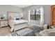 Bedroom with white bed frame and blue rug at 364 Palmaria Ct, Nokomis, FL 34275