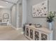 Entryway with a console table, decorative bowl, and a floral arrangement at 364 Palmaria Ct, Nokomis, FL 34275