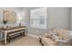 Cozy office space with desk, seating, and decorative wall art at 364 Palmaria Ct, Nokomis, FL 34275