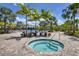Community spa with brick patio and palm trees at 364 Palmaria Ct, Nokomis, FL 34275