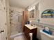 Updated bathroom with walk-in shower and new tile at 4104 Catalina Dr, Bradenton, FL 34210