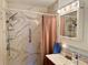 Updated bathroom with walk-in shower and new tile at 4104 Catalina Dr, Bradenton, FL 34210
