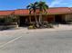 Community clubhouse with palm trees and landscaping at 4104 Catalina Dr, Bradenton, FL 34210