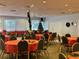 Large event room decorated for Christmas with tables, chairs, and festive decorations at 4104 Catalina Dr, Bradenton, FL 34210