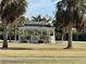 Charming gazebo nestled amongst palm trees in a lush green space at 4104 Catalina Dr, Bradenton, FL 34210