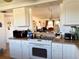 Kitchen features white cabinets, electric cooktop and oven at 4104 Catalina Dr, Bradenton, FL 34210