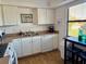 Clean kitchen featuring white cabinets and modern appliances at 4104 Catalina Dr, Bradenton, FL 34210