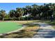 Relaxing walking path through tropical landscape near putting green at 4104 Catalina Dr, Bradenton, FL 34210