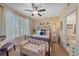 Bright bedroom with a metal bed frame and window seating at 4106 Central Sarasota Pkwy # 1026, Sarasota, FL 34238