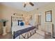 Guest bedroom with an antique-style bed and ensuite bathroom at 4106 Central Sarasota Pkwy # 1026, Sarasota, FL 34238