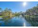 Community lake view with fountain and trees at 4106 Central Sarasota Pkwy # 1026, Sarasota, FL 34238