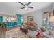 Spacious living room featuring a comfy couch and large area rug at 4106 Central Sarasota Pkwy # 1026, Sarasota, FL 34238