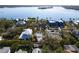 Aerial view of a house located in a waterfront community with tropical landscaping at 4189 Roberts Point Cir, Sarasota, FL 34242