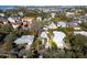 Aerial view showcasing a house nestled in a neighborhood with water access nearby at 4189 Roberts Point Cir, Sarasota, FL 34242