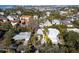 Aerial view of a single-Gathering home with a large backyard, located in a waterfront community at 4189 Roberts Point Cir, Sarasota, FL 34242