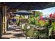 Outdoor cafe seating under umbrellas at 4189 Roberts Point Cir, Sarasota, FL 34242