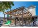 Outdoor patio with pergola, string lights, and seating at 4189 Roberts Point Cir, Sarasota, FL 34242