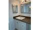 Clean bathroom with updated vanity and a large mirror at 4480 Ironwood Cir # 218A, Bradenton, FL 34209
