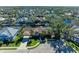 Aerial view of waterfront home with lush landscaping and driveway at 4712 Compass Dr, Bradenton, FL 34208
