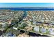 Aerial view of waterfront home with pool and private boat dock at 4712 Compass Dr, Bradenton, FL 34208