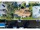 Aerial view of waterfront home with pool and private boat dock at 4712 Compass Dr, Bradenton, FL 34208