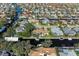 Aerial view of waterfront home with pool and private boat dock at 4712 Compass Dr, Bradenton, FL 34208