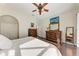 Bright bedroom with a king-size bed, dresser, and hardwood floors at 4712 Compass Dr, Bradenton, FL 34208