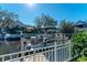 Private boat dock with covered lift and pontoon boat at 4712 Compass Dr, Bradenton, FL 34208
