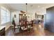 Formal dining room with hardwood floors and a large window at 4712 Compass Dr, Bradenton, FL 34208