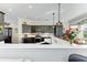 Modern kitchen with stainless steel appliances and white quartz countertops at 4712 Compass Dr, Bradenton, FL 34208