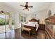 Spacious main bedroom with a king-size bed, walk-in closet, and sliding glass doors to patio at 4712 Compass Dr, Bradenton, FL 34208