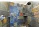 Shower with slate tile and built-in shelves at 4712 Compass Dr, Bradenton, FL 34208