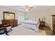 Main bedroom with a king-size bed and stylish wooden furniture at 510 Westlake Dr, Sarasota, FL 34232