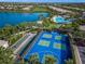 Community pickleball and bocce ball courts with lake view at 5762 Benevento Dr, Sarasota, FL 34238