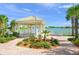 Relaxing lakeside gazebo with benches at 5762 Benevento Dr, Sarasota, FL 34238