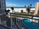 Balcony view overlooking the pool and beach at 5830 Midnight Pass Rd # 406, Sarasota, FL 34242