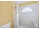 Simple bathroom with shower/tub combo and a window for natural light at 6001 Cedarwood Ln, Bradenton, FL 34203