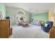 Spacious living area features vaulted ceilings, neutral decor, and a cozy seating arrangement at 6001 Cedarwood Ln, Bradenton, FL 34203