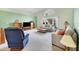 Bright living room with vaulted ceiling, neutral color palette, and ample natural light at 6001 Cedarwood Ln, Bradenton, FL 34203