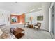 Bright living room with ample natural light and access to other rooms at 6001 Cedarwood Ln, Bradenton, FL 34203