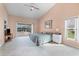 Main bedroom with sliding glass doors leading to a private patio at 6001 Cedarwood Ln, Bradenton, FL 34203