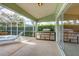 Outdoor kitchen and patio with built-in grill and seating at 6001 Cedarwood Ln, Bradenton, FL 34203