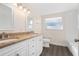 Bathroom with granite vanity, double sinks, and updated fixtures at 6227 Pauline Ave, Sarasota, FL 34231