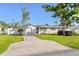 House exterior view showcasing landscaping and driveway at 6227 Pauline Ave, Sarasota, FL 34231