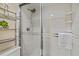 Shower with glass enclosure and metal shelving at 6703 Midnight Pass Rd # 117, Sarasota, FL 34242