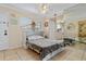 Small bedroom with a Murphy bed and view into the kitchenette at 6703 Midnight Pass Rd # 117, Sarasota, FL 34242