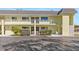 Condo building with two stories and parking at 6703 Midnight Pass Rd # 117, Sarasota, FL 34242