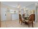 Small dining area with a table and four chairs at 6703 Midnight Pass Rd # 117, Sarasota, FL 34242