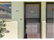 Exterior condo entrance with screen door at 6703 Midnight Pass Rd # 117, Sarasota, FL 34242