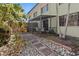 Spacious patio with screened enclosure and a path at 6703 Midnight Pass Rd # 117, Sarasota, FL 34242